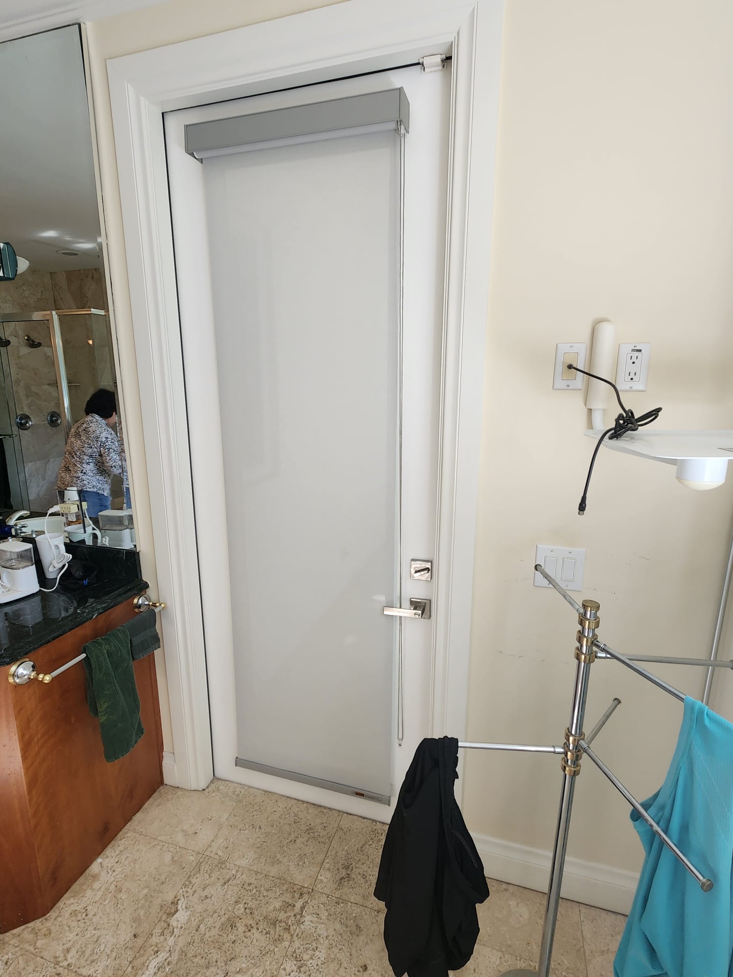 Roller shade installed on a bathroom door